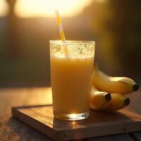 Pouring Banana Smoothie with Straw at Golden Hour photo