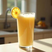 Serving of Orange Juice with Lemon Slice in Bright Kitchen photo