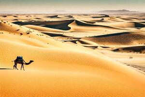 A person riding a camel through the desert photo