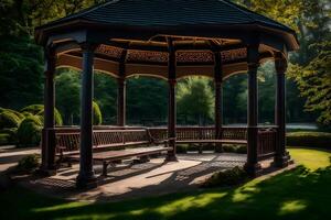 A gazebo in a park with a bench photo