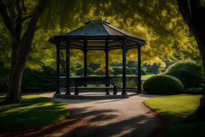 A gazebo in a park surrounded by trees photo