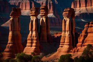 Three tall rock formations in the desert photo