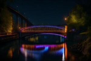 A bridge lit up at night with colorful lights photo