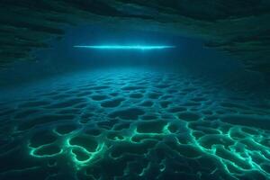 An underwater cave with glowing light coming from the bottom photo