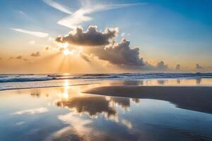 Sunset over the ocean with clouds reflected in the water photo