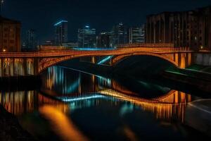 A bridge over a river at night with city lights reflected in the water photo