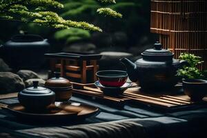 Tea set on a bamboo table with a bamboo plant photo