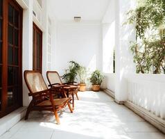Tranquil veranda with comfortable seating and greenery. photo