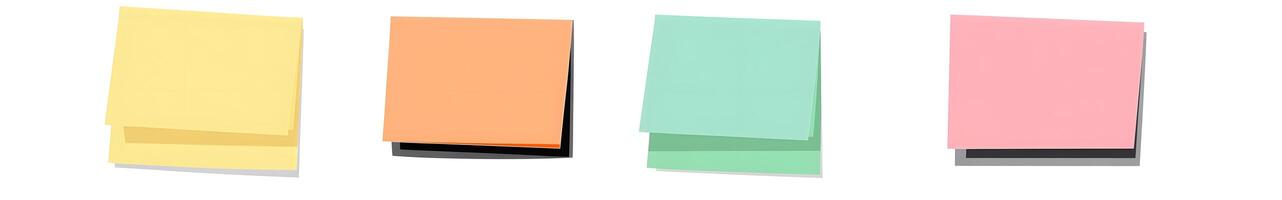 Four colorful rectangular notepads displayed in a row. photo
