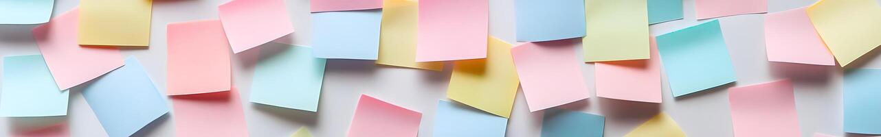 Assorted colorful sticky notes arranged on a light background. photo