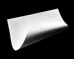 Blank sheet of paper with a curled corner. photo
