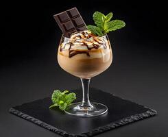Chocolate liqueur dessert drink garnished with chocolate and mint. photo