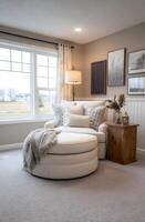 Cozy reading nook with a round ottoman. photo