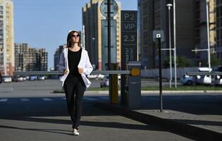 The photograph has a casual, everyday feel, as if capturing a moment in the woman's daily life. photo