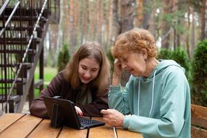 laptop at home. social media and modern technologies a pensioner studies in online security. photo