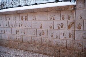 frozen stone surface with palm prints. abstract background. High quality photo