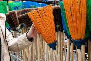 Rakes and plastic containers in a hardware store. photo