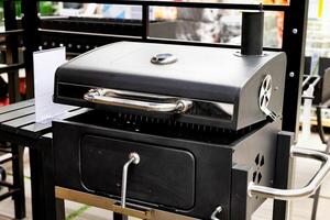 Outdoor modern black grill on display in a retail store. Temperature grill. photo
