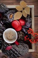 Festive autumn decor from pumpkins, berries and leaves on a white wooden background. Concept of Thanksgiving day or Halloween. Flat lay autumn composition with copy space. photo