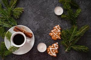 An artistic top shot of a mushroom and fern arrangement placed on a dark, wood-grained surfac photo