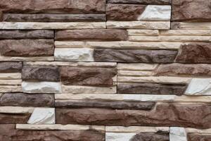 Variety of textured stone wall with neutral colors showcasing craftsmanship in architectural design photo