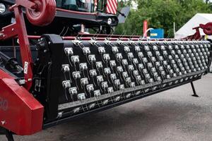 Agricultural machinery metal components and red frame. photo