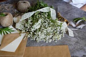 Crafting with natural elements using freshly picked flowers in a creative workspace photo