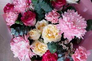 Beautiful bouquet of pink and white flowers arranged elegantly for a special occasion in a cozy setting photo