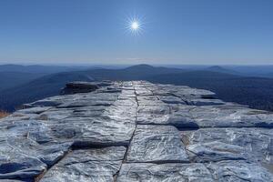 High mountaintop vista with paved stone path. photo