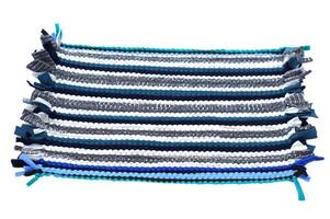 Handwoven recycled fabric rug made from upcycled textile scraps, transforming old clothes into eco-friendly functional home decor to reduce textile waste White background photo