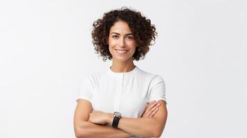 Portrait of a smiling woman with arms crossed on white background photo