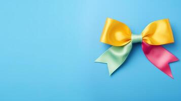 Colorful bow on blue background photo