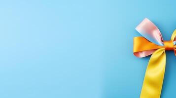 A colorful ribbon tied to a blue background photo