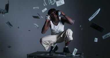 A photo shoot of a stylish modern man with dollar bills. He looks at the camera with serious look