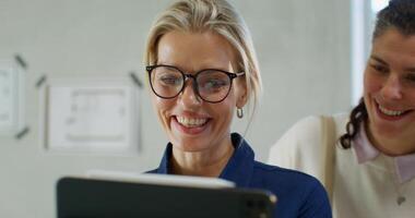 The designer and clients use the tablet to visualize home repairs photo