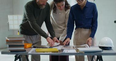 Coordination of the design project at the construction site. The designer talks to the customers photo