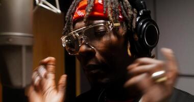 Close-up of the rapper's face during the recording of the song in the studio photo
