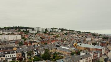 Horizontal panning from a drone, a view of an old European city located on a hill near the sea. Traditional houses and modern buildings, bird's eye view. France photo