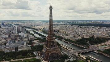 General view of the historic center of Paris with the Eiffel Tower and the river Seine on a cloudy summer day. Drone bird's eye view , France, Paris photo