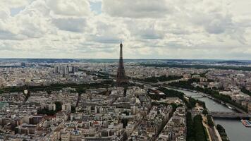 Historic center of Paris from a bird's eye view. Eiffel Tower on the banks of the Seine, drone on a cloudy summer day. France, Paris, panorama photo