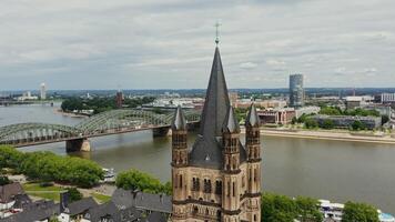 Overview of the tower of the Great Saint Martin Church from a bird's eye view. Historic center of Cologne, Germany from drone photo
