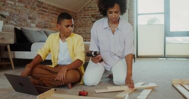 A woman and a boy are working on a project photo