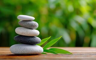 Balanced Stone Stack With Green Background in a Tranquil Setting for Relaxation and Mindfulness photo