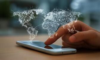 Digital Connection Illustrated Through a Hand Touching a Smartphone With a Glowing World Map Overlay photo