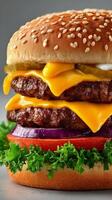 Juicy Double Cheeseburger With Lettuce, Tomato, Pickles, and Onions Served on Sesame Seed Bun photo
