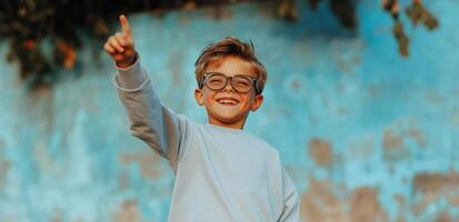 Child Joyfully Pointing Towards the Sky Against a Colorful Backdrop photo