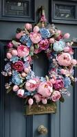 Floral Wreath Adorns Rustic Blue Door Decorated for Spring Festivities photo