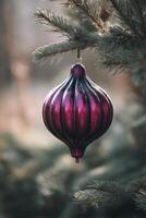 Decorative Ornament Hanging on a Pine Tree Branch During the Festive Winter Season photo