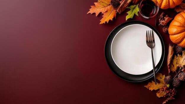 Elegant Autumn Table Setting Featuring Empty Plate, Fork, Pumpkin, and Seasonal Leaves photo
