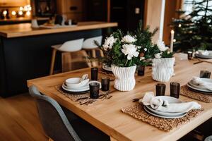 Holiday Dining Table Setup With Floral Centerpieces in a Modern Home photo